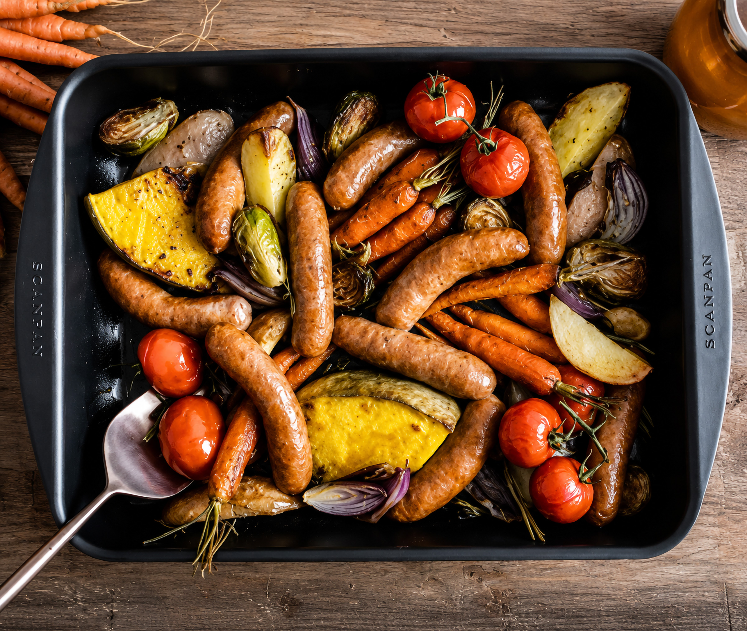Oven Baked Chipolata with Roasted Vegetables and Vine Ripened Tomatoes